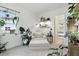 Comfortable sunroom decorated with lush indoor plants, a reading nook, and a view of the outdoors at 2118 Whiting Trl, Orlando, FL 32820