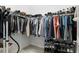 Organized walk-in closet features shelves, rods, and ample storage space for clothing and accessories at 2118 Whiting Trl, Orlando, FL 32820
