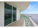 Spacious balcony with tile flooring and glass railings, with water view at 241 Riverside Dr # 902, Holly Hill, FL 32117
