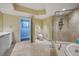 Bright bathroom with a walk-in shower, toilet, and vanity with storage, all in a neutral color palette at 241 Riverside Dr # 902, Holly Hill, FL 32117