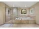 This bathroom features a glass shower and a luxurious soaking tub perfect for relaxing at 241 Riverside Dr # 902, Holly Hill, FL 32117