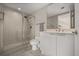 Bathroom featuring a glass-enclosed shower, toilet, and vanity with modern fixtures at 241 Riverside Dr # 902, Holly Hill, FL 32117