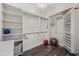 Walk-in closet with custom shelving and organization solutions at 241 Riverside Dr # 902, Holly Hill, FL 32117