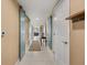 Hallway with sliding barn doors and tile floor at 241 Riverside Dr # 902, Holly Hill, FL 32117