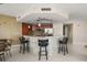 Well-appointed kitchen featuring modern appliances, a stylish breakfast bar, and ample counter space for meal preparation at 241 Riverside Dr # 902, Holly Hill, FL 32117