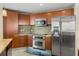 Bright kitchen with stainless steel appliances, modern cabinetry, and a sleek backsplash, offering both style and functionality at 241 Riverside Dr # 902, Holly Hill, FL 32117