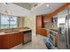 Well-designed kitchen featuring stainless steel appliances, modern cabinetry, and natural light, creating a bright and functional space at 241 Riverside Dr # 902, Holly Hill, FL 32117