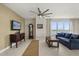 Comfortable living room with tile floors, large windows, and incredible water views at 241 Riverside Dr # 902, Holly Hill, FL 32117