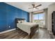 Serene main bedroom with a large window, dark wood floors, and stylish decor for a relaxing retreat at 241 Riverside Dr # 902, Holly Hill, FL 32117