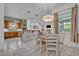 Open-concept dining area connected to the kitchen and living room with natural light at 2523 Madron Ct, Orlando, FL 32806