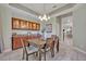 Cozy dining room with built-in cabinets, chandelier, and access to other areas of the house at 2523 Madron Ct, Orlando, FL 32806