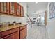 Inviting entryway with wooden cabinets and staircase leading to the upper level at 2523 Madron Ct, Orlando, FL 32806