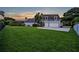 Exterior of the house with a well-manicured lawn, driveway, and garage at 2523 Madron Ct, Orlando, FL 32806