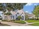 Beautiful two-story home with a well-manicured lawn and lush landscaping at 2523 Madron Ct, Orlando, FL 32806