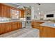 Charming kitchen with wood cabinets, stainless steel appliances, and tiled backsplash at 2523 Madron Ct, Orlando, FL 32806