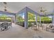 Large covered lanai with multiple seating areas and outdoor views at 2523 Madron Ct, Orlando, FL 32806