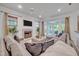 Elegant living room with fireplace, neutral décor, and access to outdoor living space at 2523 Madron Ct, Orlando, FL 32806