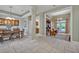 Open-concept living space connecting dining, kitchen and formal sitting room with backyard access at 2523 Madron Ct, Orlando, FL 32806