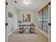 Inviting home office with sleek black desk, stylish decor, and serene natural light from the window at 2523 Madron Ct, Orlando, FL 32806