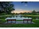 Scenic view of the pond with fountain from a park bench at 2523 Madron Ct, Orlando, FL 32806