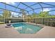 Screened swimming pool with a spa and decorative bowl at 2523 Madron Ct, Orlando, FL 32806