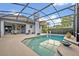 View of the screened pool area with patio and fenced yard at 2523 Madron Ct, Orlando, FL 32806