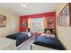 Charming bedroom featuring twin beds and cheerful Mickey Mouse decor at 2531 Maneshaw Ln, Kissimmee, FL 34747