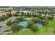 Community amenities include tennis courts and a blue basketball court, surrounded by lush landscaping and open space at 2531 Maneshaw Ln, Kissimmee, FL 34747
