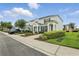 Beautiful townhome with landscaped front yard, driveway, and charming entryway at 2531 Maneshaw Ln, Kissimmee, FL 34747