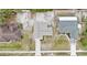 Aerial view of a home with a well-manicured lawn, with driveway for off-street parking at 2741 Beaver Dr, Deltona, FL 32725