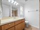 Bathroom with a vanity sink, mirror, lighting, and tile flooring at 2741 Beaver Dr, Deltona, FL 32725