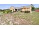 Inviting single-story home featuring manicured landscaping, a two-car garage, and a welcoming front entrance at 2741 Beaver Dr, Deltona, FL 32725