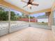 Enclosed lanai with tile flooring offering a view of the backyard and a screen door at 2741 Beaver Dr, Deltona, FL 32725