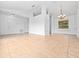 Spacious, bright living area with tile flooring and a view to an adjacent living space at 2741 Beaver Dr, Deltona, FL 32725