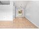 Bright and airy living space with tile flooring and a view to the dining area with chandelier at 2741 Beaver Dr, Deltona, FL 32725