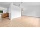 Bright, open-concept living room with neutral tile flooring and a view to the kitchen area at 2741 Beaver Dr, Deltona, FL 32725