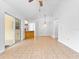 Spacious living room with tile flooring, bright lighting, and open access to other rooms at 2741 Beaver Dr, Deltona, FL 32725