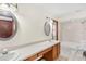 Bathroom featuring double sinks, wooden cabinets, and a separate toilet and shower area at 2809 Gulf Winds Ct, Oviedo, FL 32765