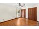 This room features hardwood floors, a ceiling fan, and wood sliding closet doors, creating a comfortable space at 2809 Gulf Winds Ct, Oviedo, FL 32765