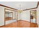 Open dining room space with wood floors and an ornate chandelier at 2809 Gulf Winds Ct, Oviedo, FL 32765