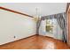 Empty dining room with wood floors, a large window, and an ornate chandelier at 2809 Gulf Winds Ct, Oviedo, FL 32765