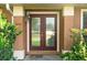A close up of the glass paneled double doors at 2809 Gulf Winds Ct, Oviedo, FL 32765