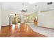 Bright living room features hardwood floors, natural light from windows and sliding doors, plus a ceiling fan at 2809 Gulf Winds Ct, Oviedo, FL 32765