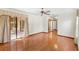 Spacious room with hardwood floors, large sliding glass doors, and ceiling fan at 2809 Gulf Winds Ct, Oviedo, FL 32765