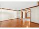 Empty living room with wood floors, white walls, and wood trim at 2809 Gulf Winds Ct, Oviedo, FL 32765