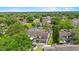 Aerial view of home surrounded by trees in a quiet neighborhood, with ample parking at 2930 Candela Ct, Apopka, FL 32703