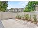 Fenced-in backyard with patio and view of the townhome complex at 2930 Candela Ct, Apopka, FL 32703