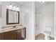 Bathroom featuring a modern vanity with lots of light and a step-in shower and bathtub at 2930 Candela Ct, Apopka, FL 32703