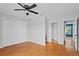 Bedroom with wood floors and access to the bathroom and closet, plus plenty of light at 2930 Candela Ct, Apopka, FL 32703