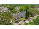 Aerial view of cozy townhomes with backyard patio areas surrounded by green grass and lush tree coverage at 2930 Candela Ct, Apopka, FL 32703